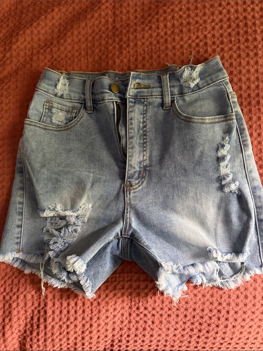 High-Rise Light Blue Distressed Denim Shorts